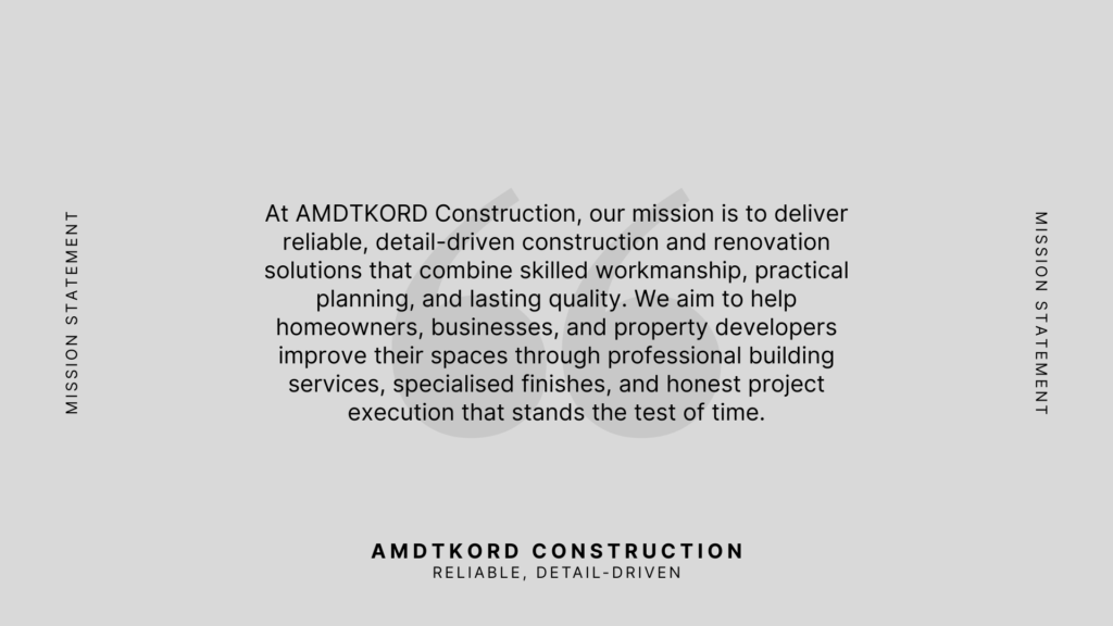 Amdtkord Construction mission statement brand slide with clean typography and grey background.