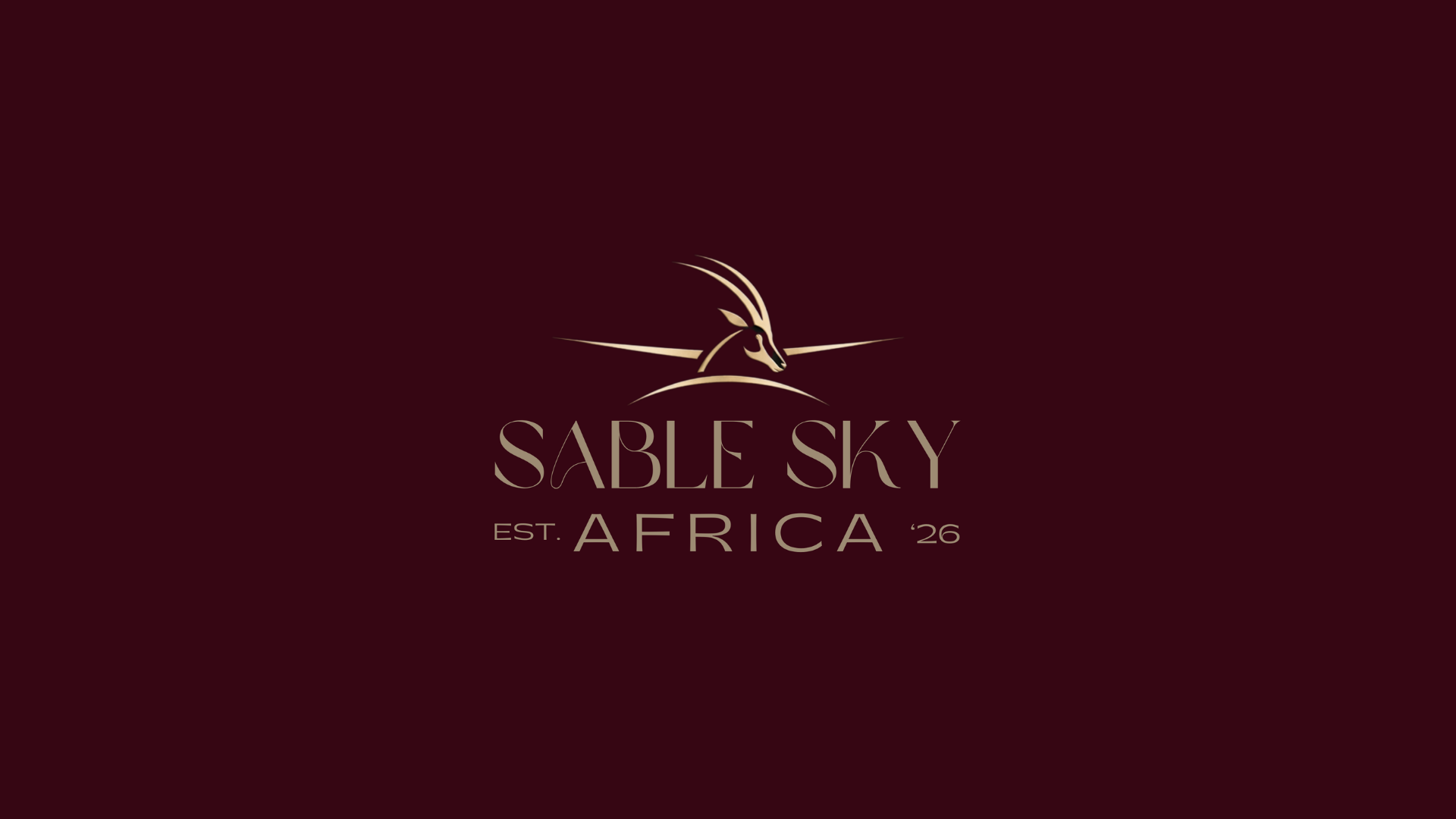 SableSky Africa luxury aviation logo in gold on deep burgundy background.